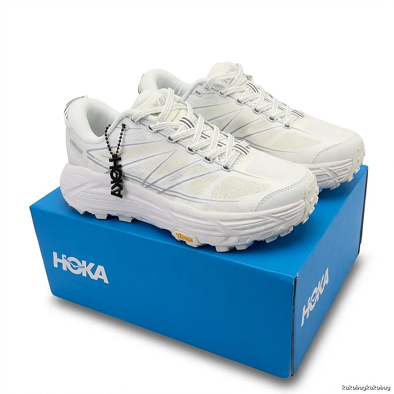 HOKA retro-style white sports shoes