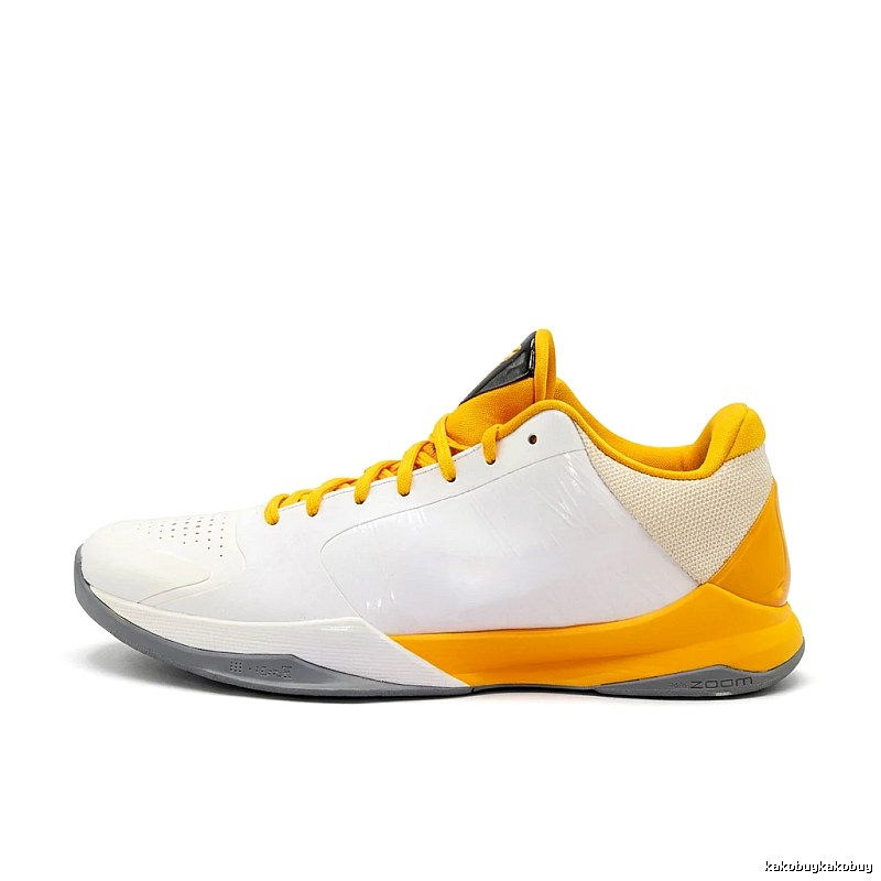 White and yellow color scheme of Nike basketball shoes